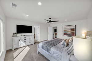 Bedroom featuring ceiling fan and light carpet