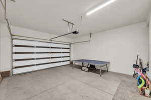 Garage featuring a garage door opener