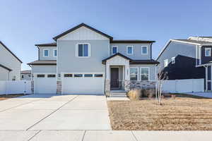 View of front of property featuring a garage