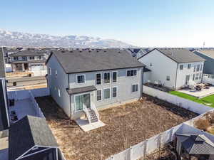 Rear view of house featuring a mountain view