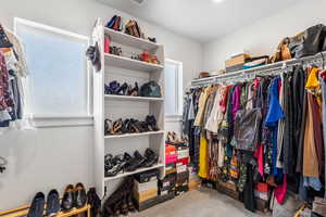 Spacious closet featuring carpet