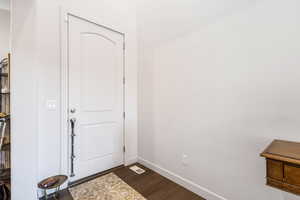 Foyer entrance featuring dark hardwood / wood-style floors