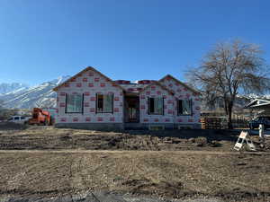 Property in mid-construction with a carport and a mountain view