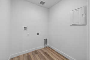 Laundry area featuring washer hookup, wood-type flooring, and hookup for an electric dryer