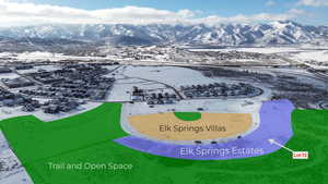 Snowy aerial view featuring a mountain view