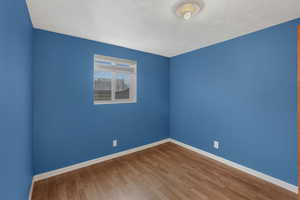 Spare room featuring hardwood / wood-style floors