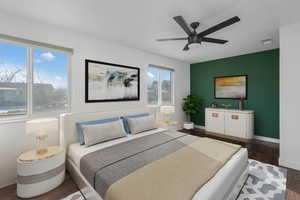 Bedroom with dark hardwood / wood-style floors and ceiling fan