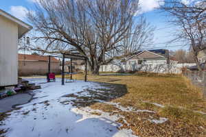 View of yard covered in snow