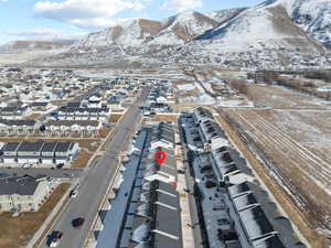 Snowy aerial view featuring a mountain view