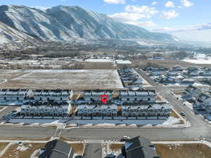 Snowy aerial view featuring a mountain view