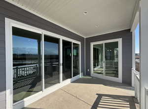 View of patio featuring a mountain view and a balcony