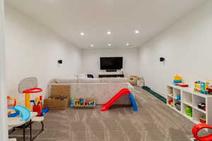 Recreation room featuring carpet flooring