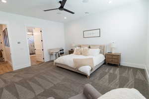 Primary Carpeted bedroom featuring ceiling fan