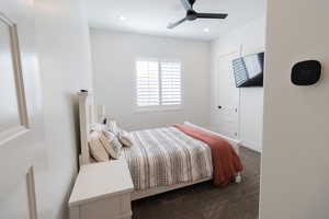 Bedroom with ceiling fan and carpet floors