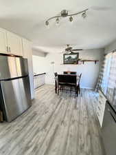 Dining room with ceiling fan and light hardwood / wood-style flooring