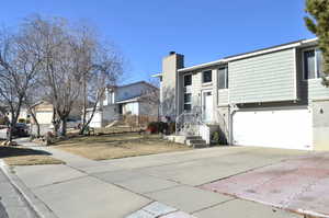 View of front of property featuring a garage