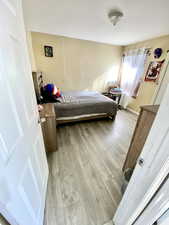 Bedroom with light wood-type flooring