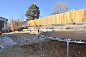 View of yard with a trampoline