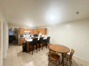 Dining room with light tile patterned floors