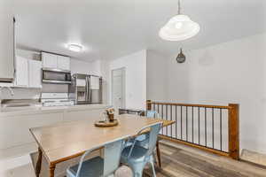 Dining room featuring sink and light hardwood / wood-style floors