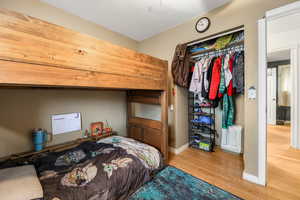 Bedroom featuring wood-type flooring