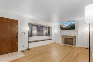 Unfurnished living room featuring light hardwood / wood-style floors