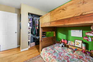 Bedroom with a closet and light wood-type flooring