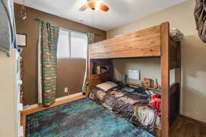 Bedroom with wood-type flooring and ceiling fan