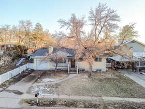 View of front facade featuring a garage