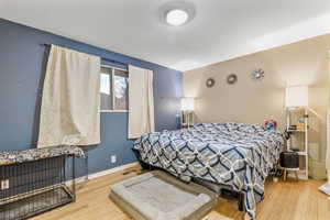 Bedroom with wood-type flooring