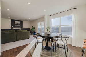 Dining space featuring dark wood-type flooring and plenty of natural light