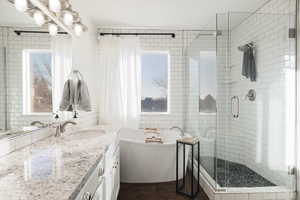 Large primary bathroom with double vanity.