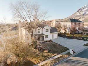 View of front of house featuring a garage and a mountain view