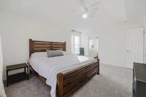 Bedroom with vaulted ceiling and a luxurious primary en-suite plus walk-in closet.