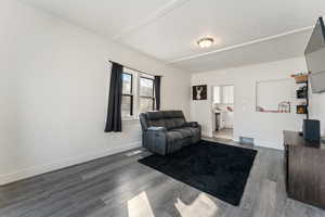 Living room with dark hardwood / wood-style floors