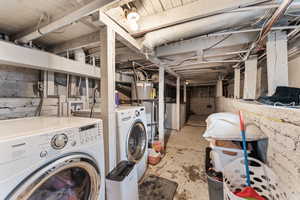 Washroom featuring washing machine and dryer