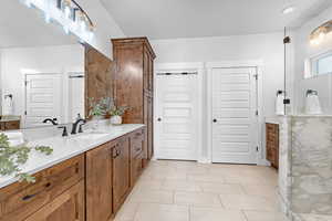 Bathroom with vanity and tile patterned floors