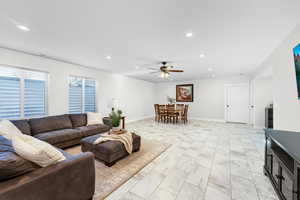 Living room featuring ceiling fan