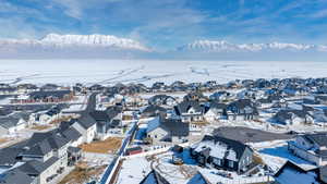 Snowy aerial view with a mountain view