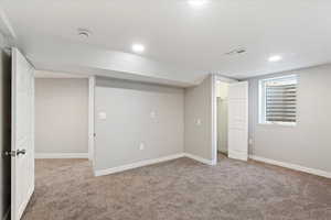 Basement with carpet flooring