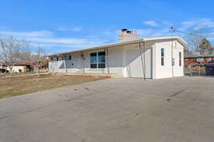 View of front facade with a garage and covered porch