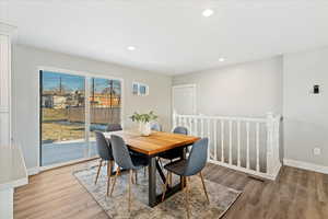 Dining space with wood-type flooring