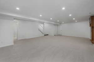 Basement with light carpet