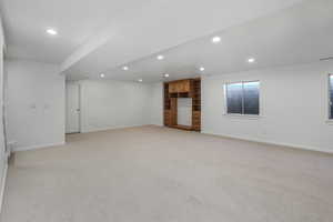 Basement with light colored carpet