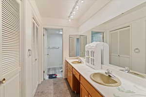 Bathroom featuring vanity and track lighting