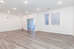 Spare room with light hardwood / wood-style flooring