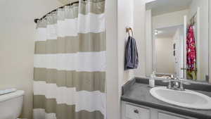 Bathroom with vanity and toilet