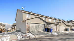 View of garage and central a/c unit