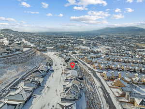 Snowy aerial view with a mountain view