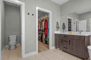 Bathroom with vanity and toilet